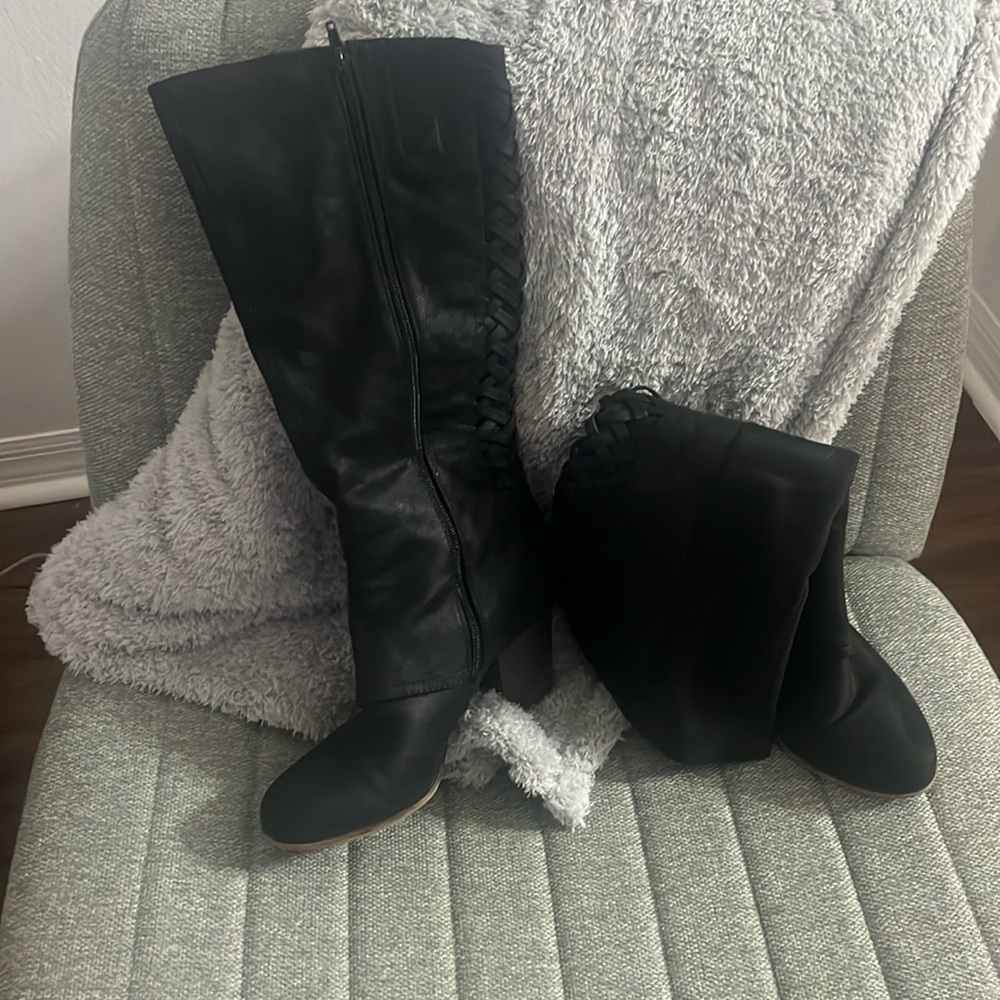 Knee high boots with a lace up back